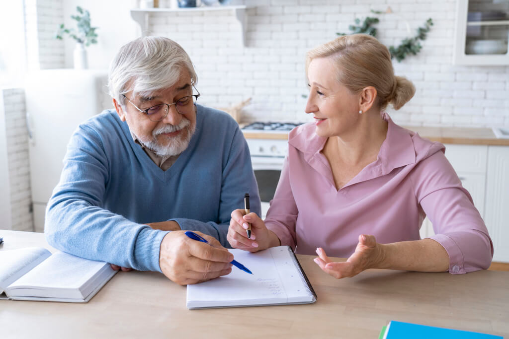 close-up-senior-couple-while-planning