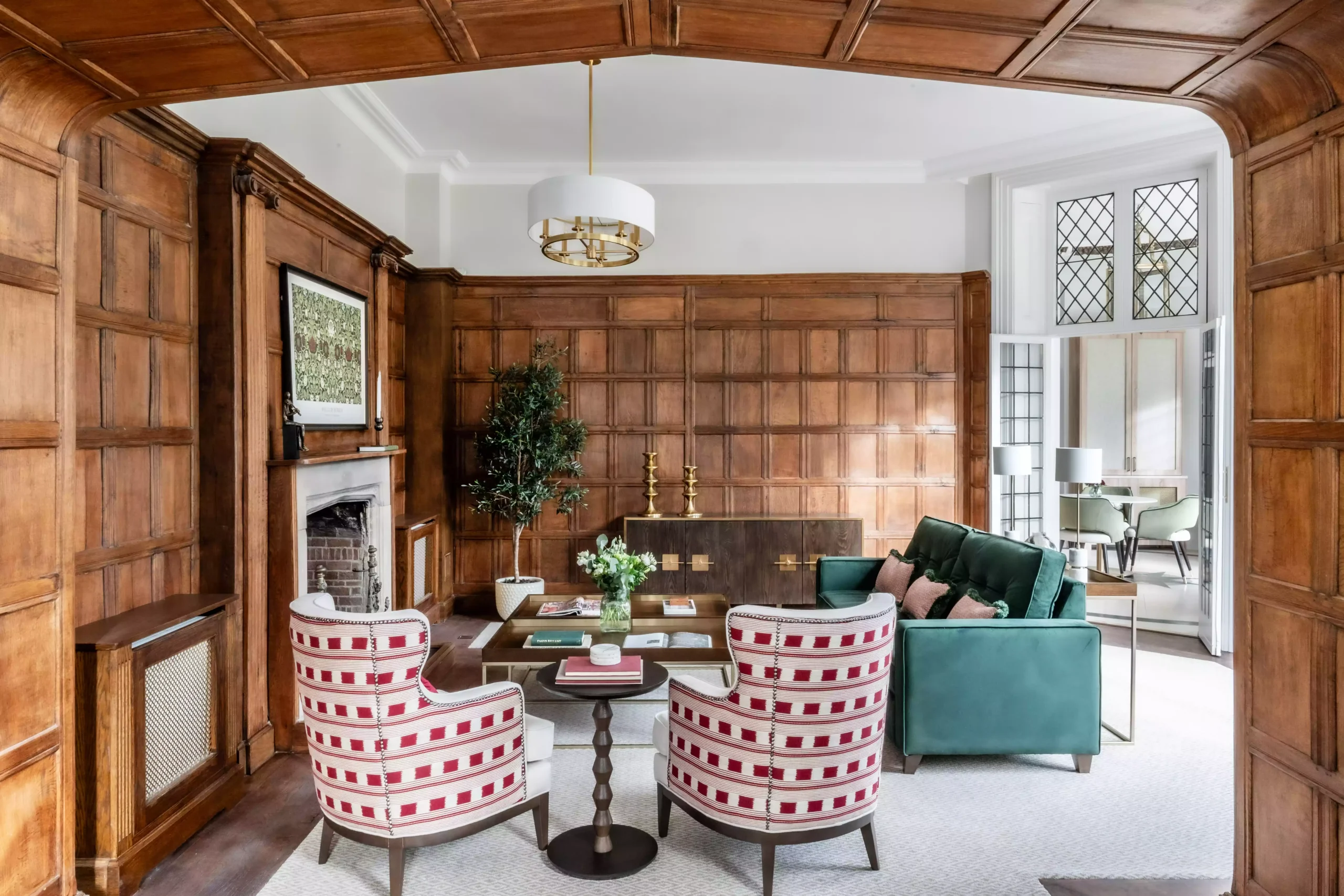 A luxury room with sofa and chairs in it.