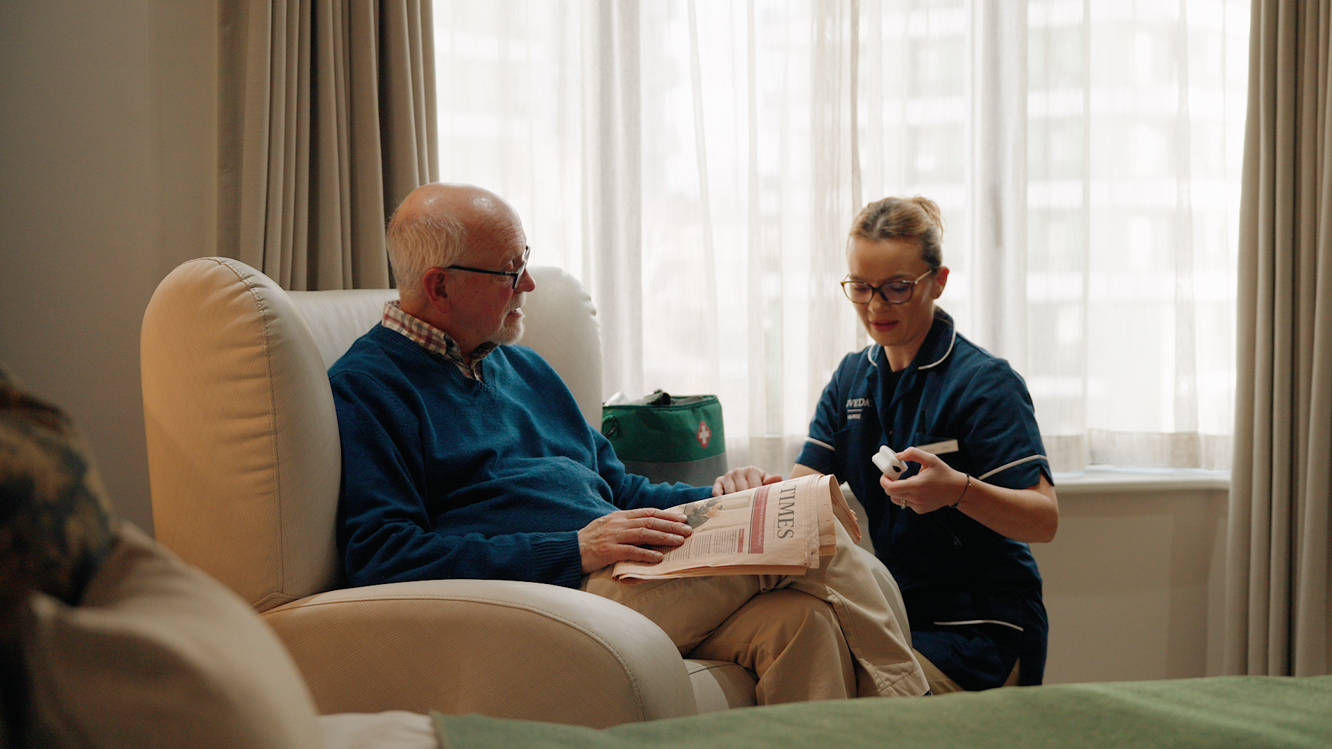 Nurse attending to permanent resident at Loveday care home